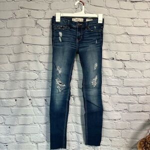 Hollister Blue Skinny Jeans with Distressing and Worn-In Look